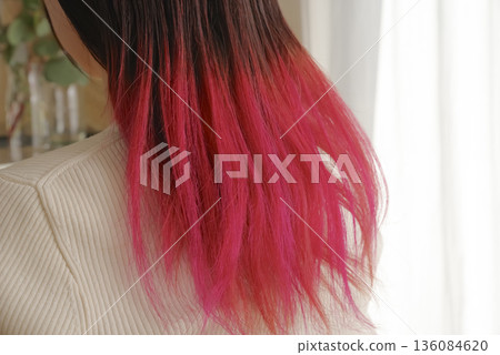 A young woman's hair with colored tips A young woman's hair with colored tips 136084620