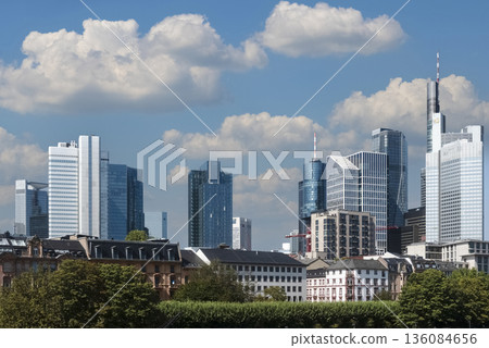 City Skyline with Modern Skyscrapers on Sunny Day 136084656