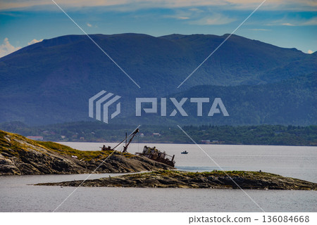 Norwegian coastline with fishing boat Norwegian coastline with fishing boat 136084668