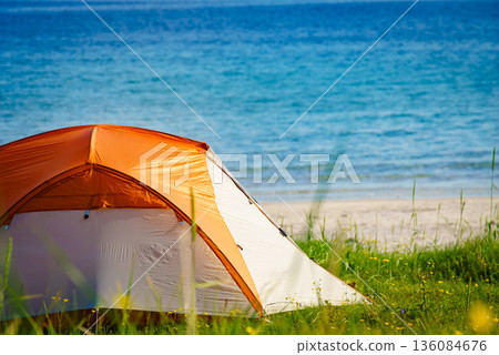 Seascape with tent on beach, Lofoten Norway Seascape with tent on beach, Lofoten Norway 136084676