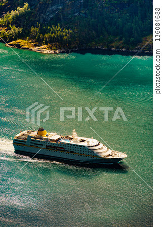 Big cruise ship on fjord in Norway. 136084688