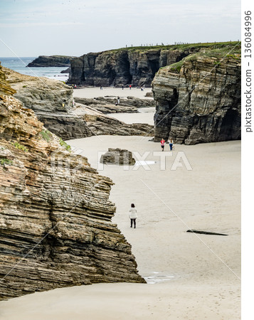 People walking on Beach Cathedrals Beach, Galicia Spain. People walking on Beach Cathedrals Beach, Galicia Spain. 136084996