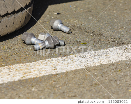 Changing tire car on road 136085021