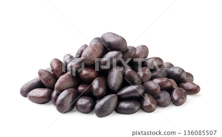 Pile of sunflower seeds covered chocolate close-up on a white background. Isolated Pile of sunflower seeds covered chocolate close-up on a white background. Isolated 136085507