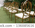 Rows of Elegant Golden Chairs at Outdoor Wedding Ceremony 136085616