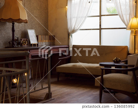 A nostalgic and retro-modern scene in an antique-style cafe bathed in soft light 136085992