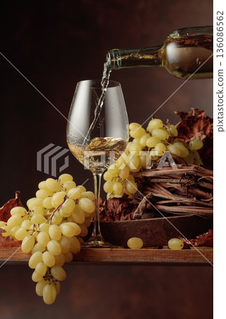 Wine is poured into a glass. 136086562