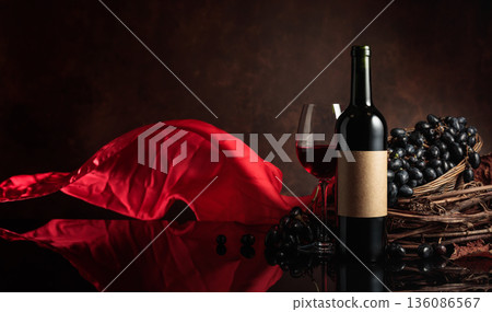 Red wine with grapes on a background of red flutters curtain. 136086567