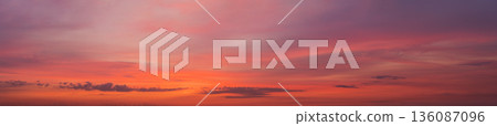 wide panorama of sunset clouds in the sky in summer evening wide panorama of sunset clouds in the sky in summer evening 136087096