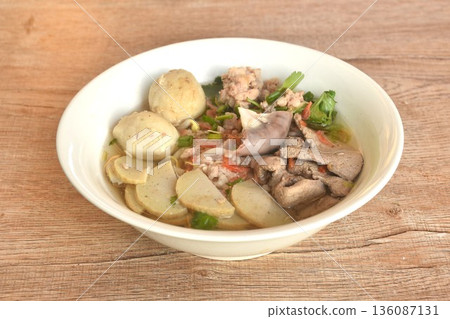 slice Vietnamese sausage and chop pork couple liver with meatball in clear soup on bowl 136087131