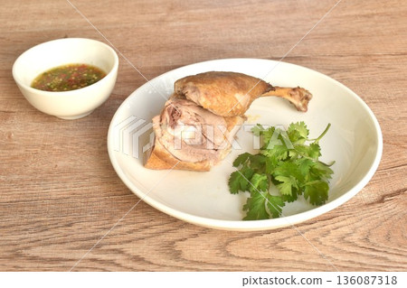 boiled duck meat and leg in black soybean sauce on plate dipping spicy chili sauce boiled duck meat and leg in black soybean sauce on plate dipping spicy chili sauce 136087318