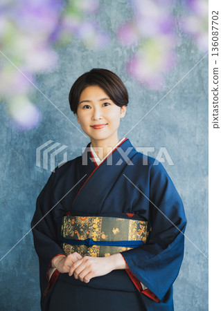 Woman wearing a tsukesage, Japanese clothing, kimono, visiting kimono Woman wearing a tsukesage, Japanese clothing, kimono, visiting kimono 136087702
