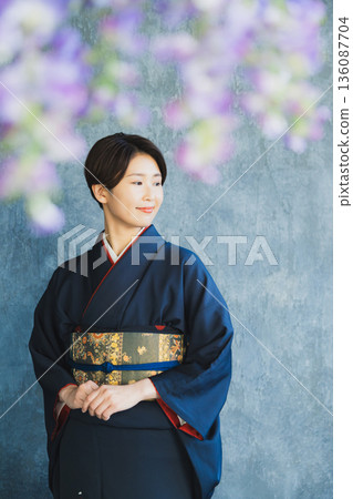 Woman wearing a tsukesage, Japanese clothing, kimono, visiting kimono 136087704