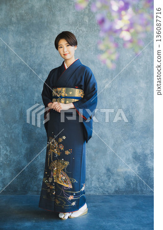 Woman wearing a tsukesage, Japanese clothing, kimono, visiting kimono 136087716