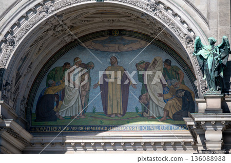 Berlin, germany, august 11, 2023. Berlin cathedral entrance mosaic of jesus teaching and welcoming the sick, poor and suffering, symbolizing compassion and hope Berlin, germany, august 11, 2023. Berlin cathedral entrance mosaic of jesus teaching and welcoming the sick, poor and suffering, symbolizing compassion and hope 136088988