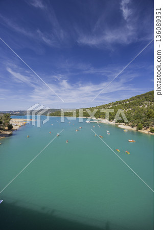 Lac de Sainte Croix turquoise water with people kayaking Lac de Sainte Croix turquoise water with people kayaking 136089351