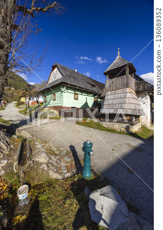 Traditional wooden architecture and bell tower in Vlkolinec, Slovakia Traditional wooden architecture and bell tower in Vlkolinec, Slovakia 136089352