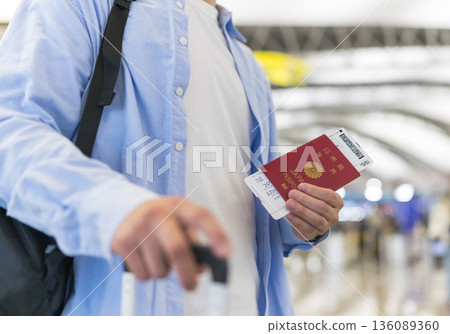 Passport and boarding pass at the airport ■Photography cooperation: Kansai International Airport (KIX) Passport and boarding pass at the airport ■Photography cooperation: Kansai International Airport (KIX) 136089360