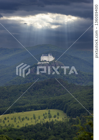 Fuzer Castle receiving sun rays through dramatic clouds Fuzer Castle receiving sun rays through dramatic clouds 136089400
