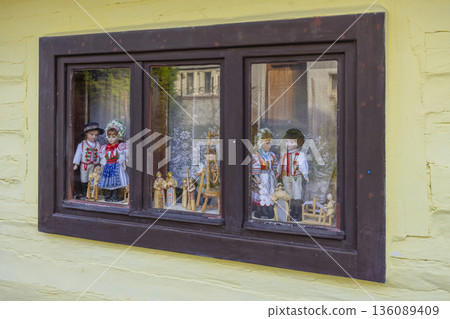 Traditional Slovak dolls displaying folk costume in Vlkolinec Traditional Slovak dolls displaying folk costume in Vlkolinec 136089409