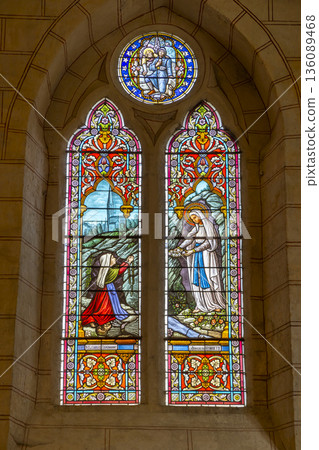 Stained glass window depicting Marian apparition in Auvillar church Stained glass window depicting Marian apparition in Auvillar church 136089468