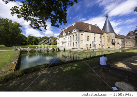 Chateau de Commarin historic French castle reflecting in moat Chateau de Commarin historic French castle reflecting in moat 136089483