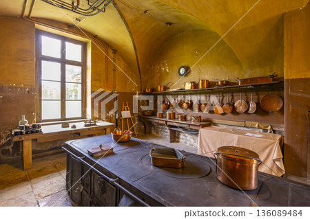 Historic kitchen interior with copper cookware in Commarin, France 136089484