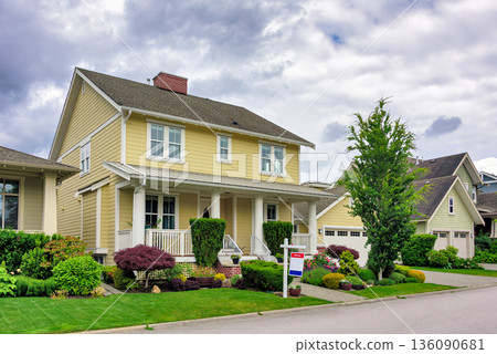 A perfect neighborhood. Nicely landscaped front yard of luxury residential house for sale 136090681