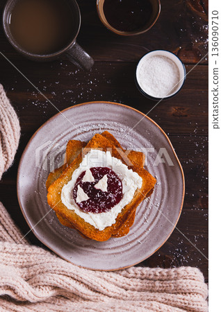 Delicious toasts with cream cheese, jam, paste and coconut flakes on a plate top and vertical view Delicious toasts with cream cheese, jam, paste and coconut flakes on a plate top and vertical view 136090710