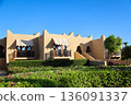 A luxury hotel in an Arabian resort with a green, lush garden and large grounds 136091337