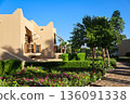 A luxury hotel in an Arabian resort with a green, lush garden and large grounds 136091338
