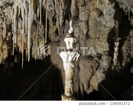 stalactites and stalagmites inside karst caves carved out by water 136091372