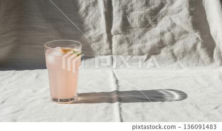Minimalist Iced Tea with Lemon and Mint on Linen Tablecloth Minimalist Iced Tea with Lemon and Mint on Linen Tablecloth 136091483