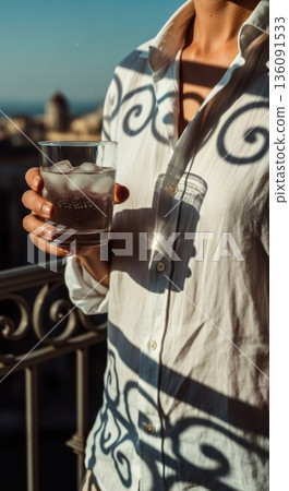 Person in White Shirt Holding a Cold Glass of Water with Ice Person in White Shirt Holding a Cold Glass of Water with Ice 136091533
