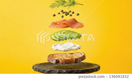 Deconstructed Salmon And Avocado Toast Ingredients yellow background Deconstructed Salmon And Avocado Toast Ingredients yellow background 136091832