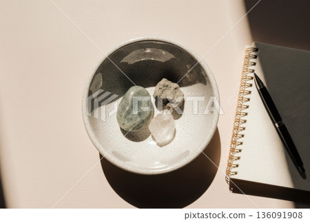 Crypto Storage Types as Natural Stones in Ceramic Bowl Crypto Storage Types as Natural Stones in Ceramic Bowl 136091908