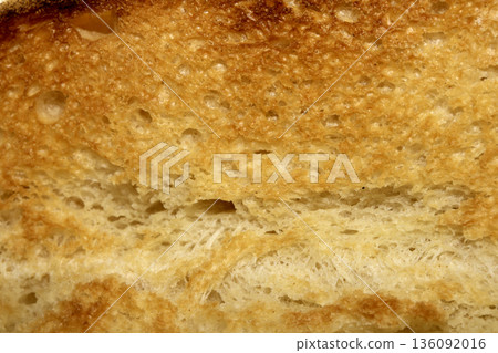 Close up of toast bread food texture golden toasted Close up of toast bread food texture golden toasted 136092016