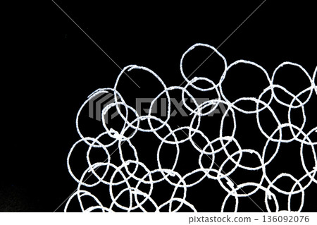 Intertwining hand drawn cirles spheres white and black illustration background 136092076
