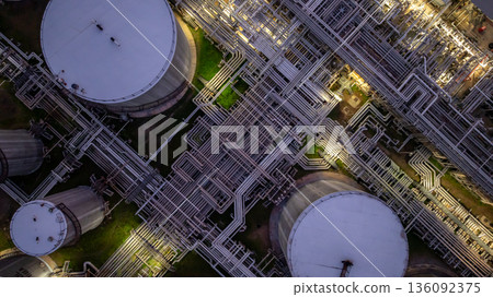 Aerial view Oil and Gas refinery plant at night, Global business energy logistic transportation, Oil and gas refinery petrochemical industrial, Petrochemical refinery industrial energy supply chain. 136092375