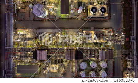 Aerial view Oil and Gas refinery plant at night, Global business energy logistic transportation, Oil and gas refinery petrochemical industrial, Petrochemical refinery industrial energy supply chain. Aerial view Oil and Gas refinery plant at night, Global business energy logistic transportation, Oil and gas refinery petrochemical industrial, Petrochemical refinery industrial energy supply chain. 136092376