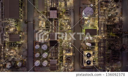 Aerial view Oil and Gas refinery plant at night, Global business energy logistic transportation, Oil and gas refinery petrochemical industrial, Petrochemical refinery industrial energy supply chain. 136092378