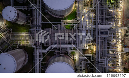 Aerial view Oil and Gas refinery plant at night, Global business energy logistic transportation, Oil and gas refinery petrochemical industrial, Petrochemical refinery industrial energy supply chain. 136092397