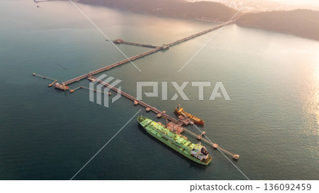 Aerial view LPG tanker ship at oil and gas terminal platform, Liquefied Petroleum Gas tanker ship industrial oil gas terminal tanker ship, LPG tanker ship loading and unloading petrochemical industry. 136092459