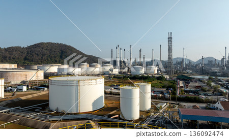 Aerial view of oil and gas petrochemical storage tank and pipeline steel, Oil and gas transportation system pipeline steel at oil and gas refinery industry petrochemical plant, Pipeline oil and gas. Aerial view of oil and gas petrochemical storage tank and pipeline steel, Oil and gas transportation system pipeline steel at oil and gas refinery industry petrochemical plant, Pipeline oil and gas. 136092474