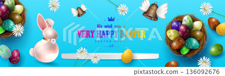 Happy Easter. A festive blue arrangement featuring a straw nest with eggs and a cute bunny 136092676