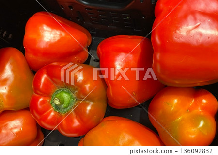 Vibrant Red Bell Peppers in a Produce Bin Vibrant Red Bell Peppers in a Produce Bin 136092832