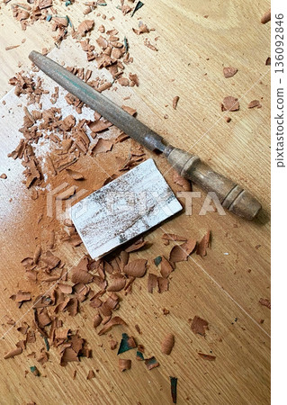 Woodworking tools and shavings on a wooden surface 136092846