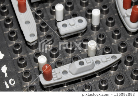 Close up of strategic battleships board game with ships and pegs 136092898