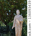 Stone Buddha statue in tropical garden Vietnam 136093439