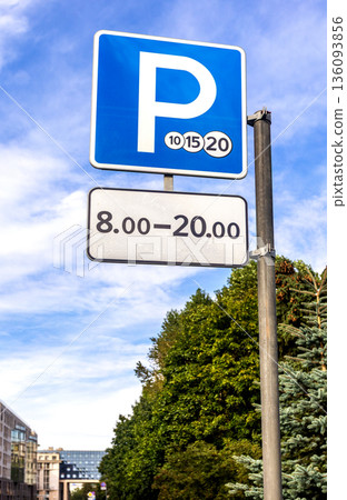 Paid parking road sign against the sky. Parking zone with paid parking sign 136093856